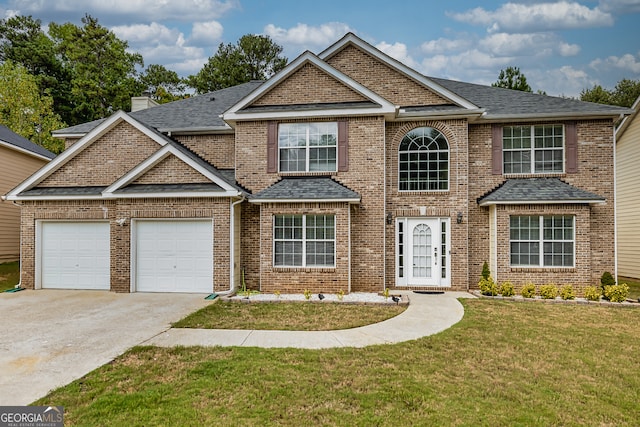 view of front facade featuring a garage and a front lawn