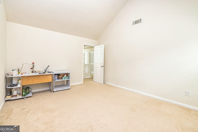 miscellaneous room featuring carpet floors and high vaulted ceiling