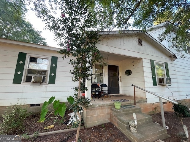 view of front of property with cooling unit