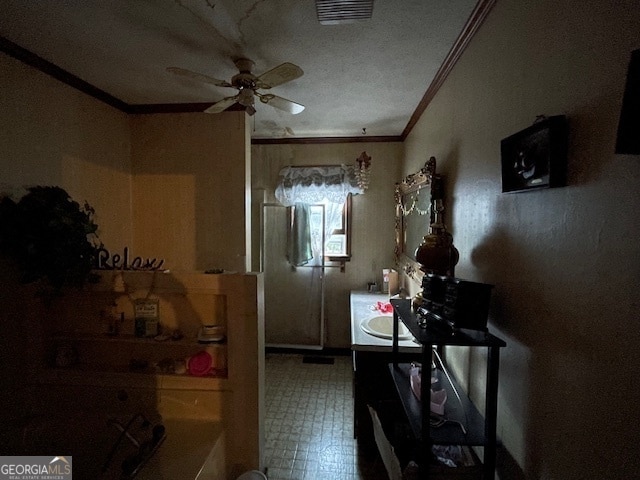 interior space featuring crown molding and ceiling fan