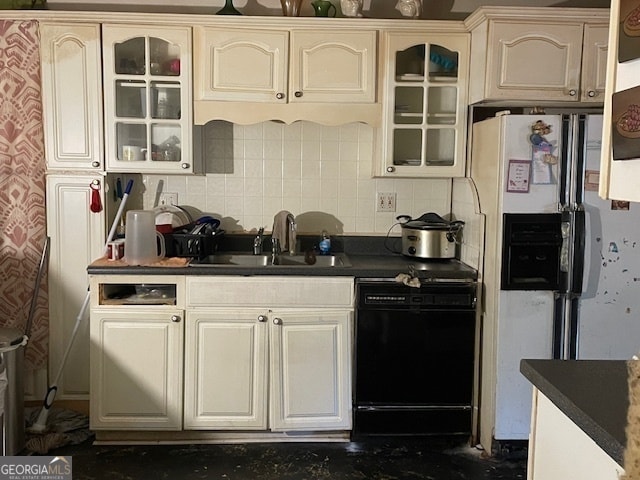 kitchen featuring white fridge with ice dispenser, dishwasher, sink, and tasteful backsplash