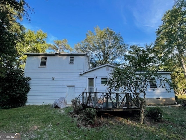 back of house with a yard