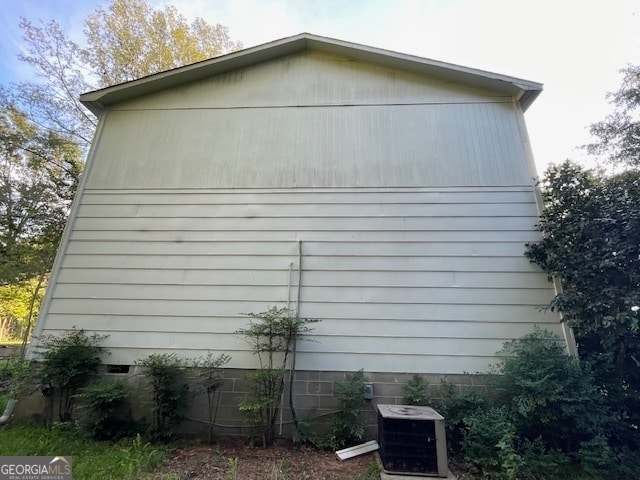 view of home's exterior with central AC