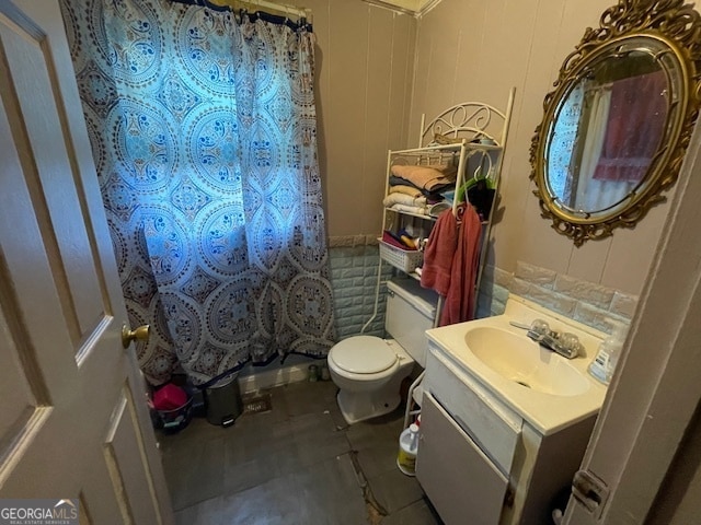 bathroom featuring vanity, toilet, a shower with shower curtain, and tile patterned floors