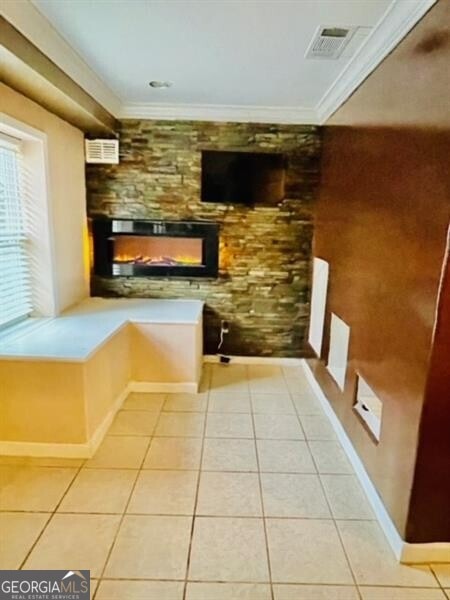 interior space featuring crown molding and tile patterned floors