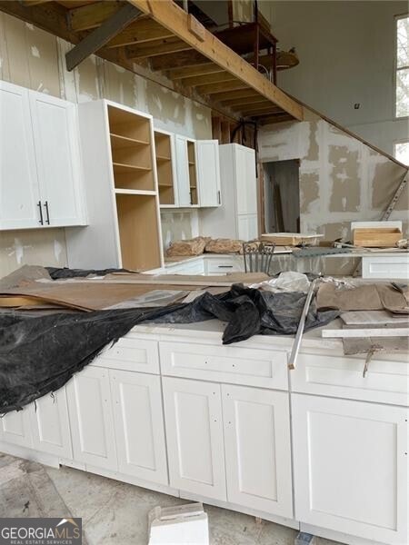 kitchen featuring white cabinets