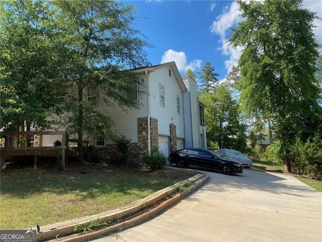 view of property exterior with a garage