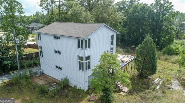 view of property exterior with central AC