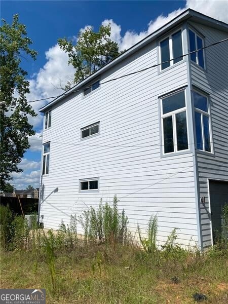 view of home's exterior with a garage