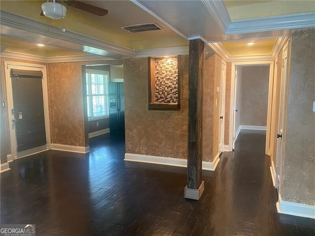 interior space featuring ornamental molding and dark hardwood / wood-style flooring