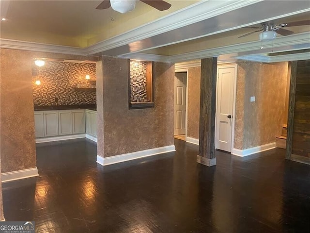 interior space with ornamental molding, dark hardwood / wood-style floors, and ceiling fan