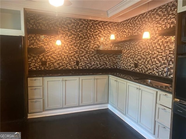 kitchen featuring dark stone counters, ornamental molding, ceiling fan, and tasteful backsplash