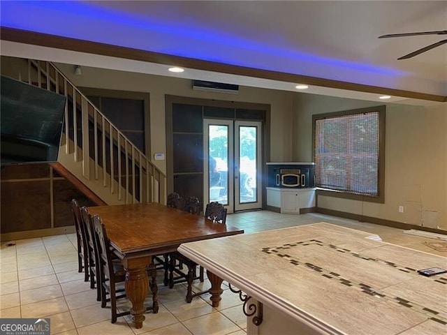 dining area with ceiling fan and light tile patterned floors