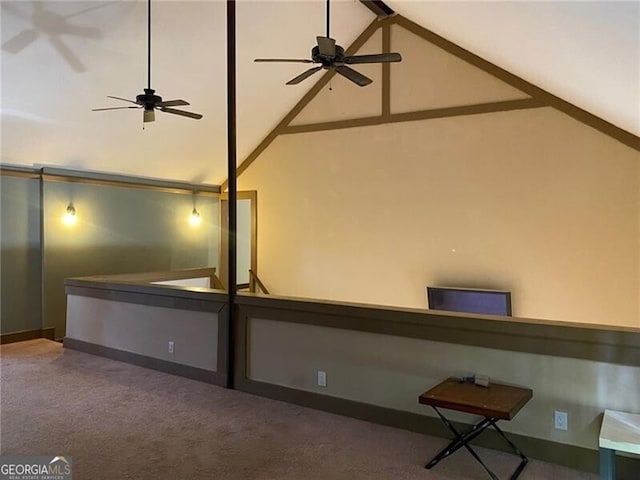 interior space featuring ceiling fan, carpet, and high vaulted ceiling