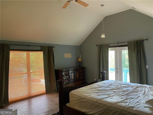 tiled bedroom with french doors, vaulted ceiling, ceiling fan, and access to outside