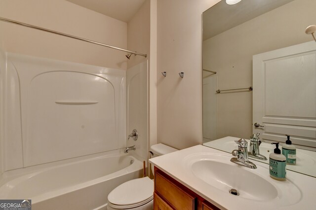 full bathroom featuring  shower combination, vanity, and toilet