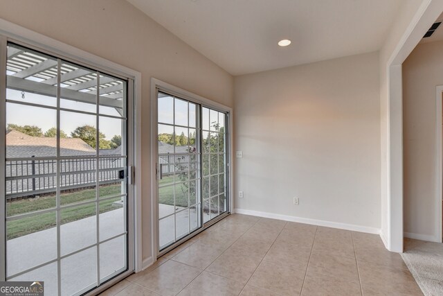 empty room with light tile patterned floors