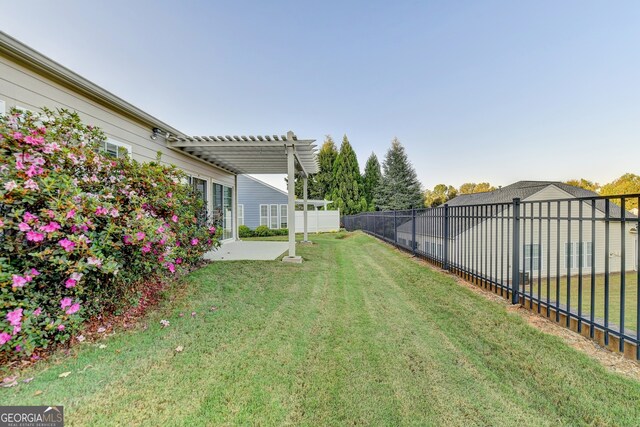 view of yard with a pergola and a patio area