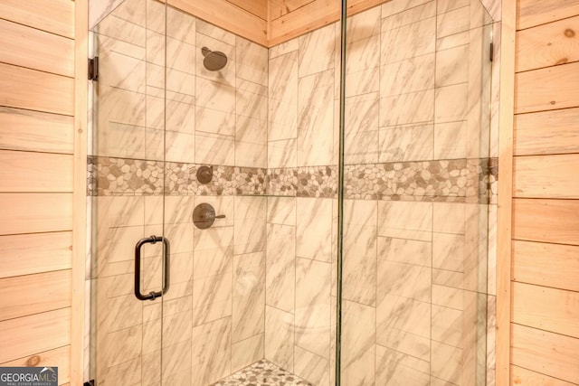 room details featuring a shower with door