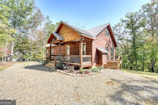 view of side of home with a porch