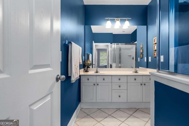 bathroom with vanity, tile patterned floors, and an enclosed shower