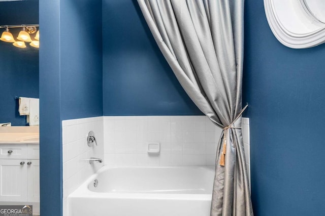 bathroom with vanity and a bathtub