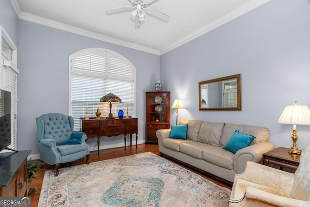 living room featuring ceiling fan, hardwood / wood-style floors, and crown molding