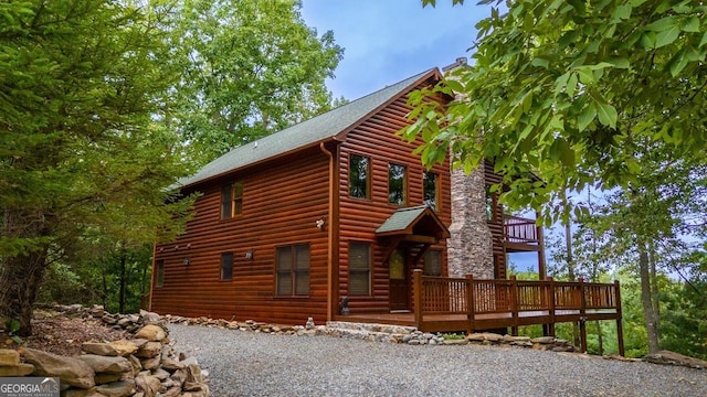 view of side of property featuring a deck