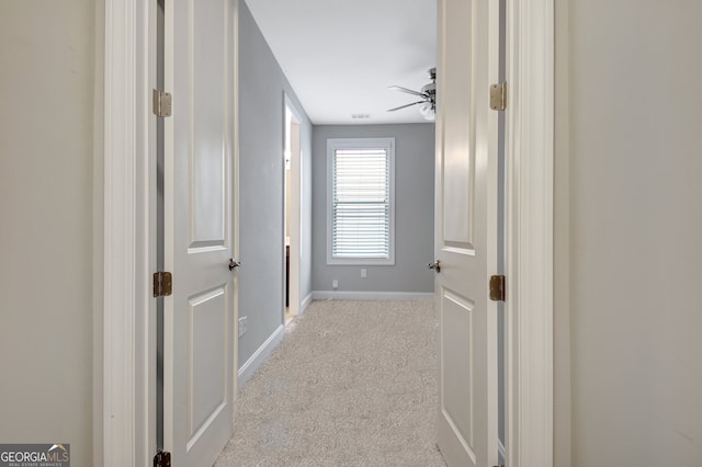 corridor with light carpet