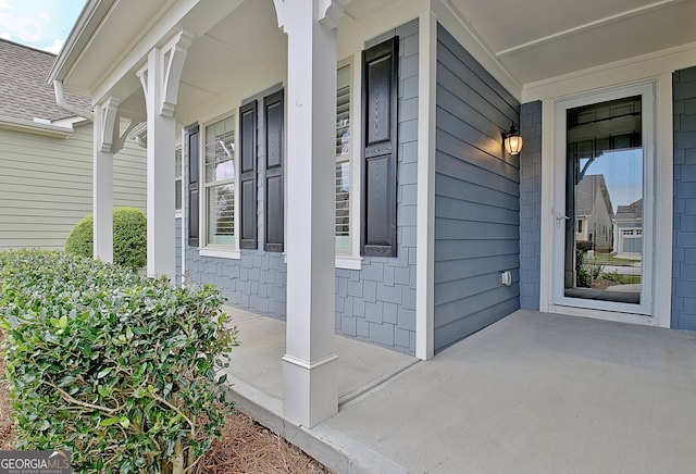 property entrance with covered porch