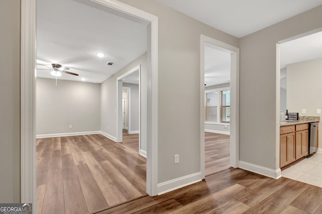 hallway with light wood-type flooring