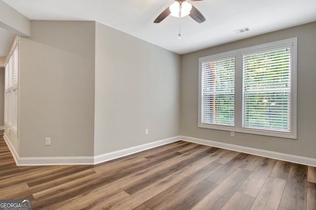 spare room featuring ceiling fan and hardwood / wood-style floors