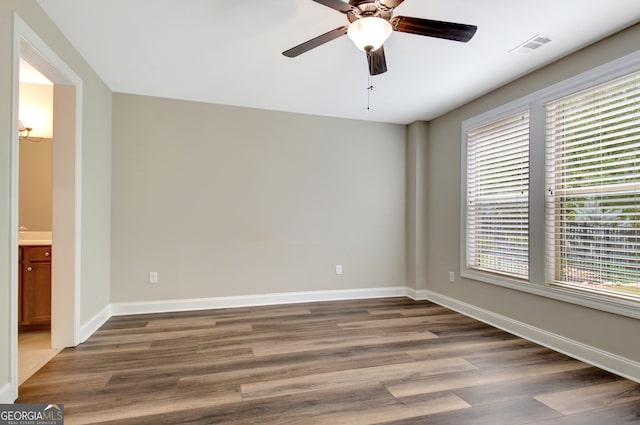 spare room with ceiling fan and hardwood / wood-style floors