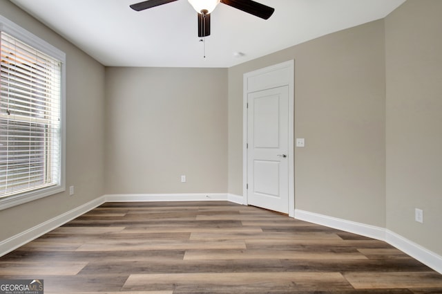 empty room featuring hardwood / wood-style floors and ceiling fan