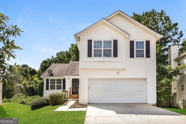 front facade featuring a front yard and a garage