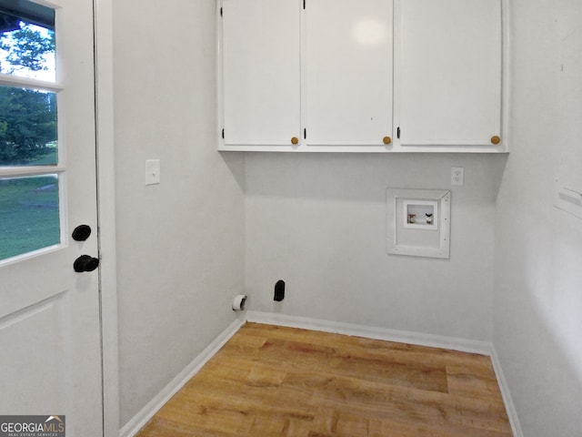 washroom featuring washer hookup, a wealth of natural light, and light wood-type flooring