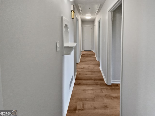 corridor featuring light hardwood / wood-style floors