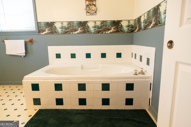 bathroom with tiled tub