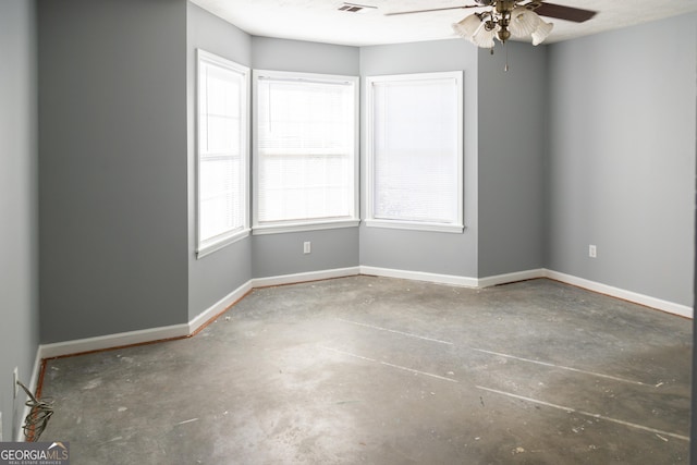 unfurnished room with concrete floors and ceiling fan