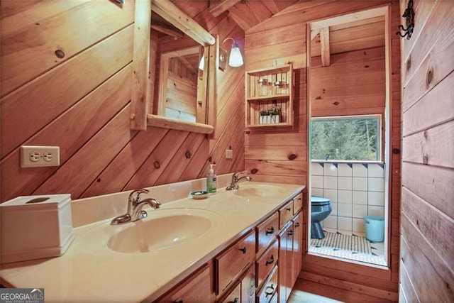 bathroom with wood walls, vanity, and toilet