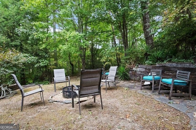 view of patio featuring an outdoor fire pit