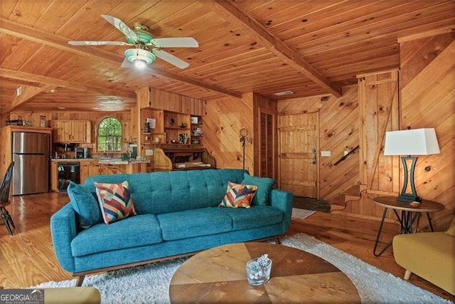 living room featuring wood walls and light hardwood / wood-style floors