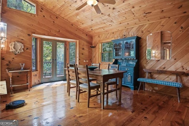 dining space featuring wood ceiling, light hardwood / wood-style flooring, and plenty of natural light