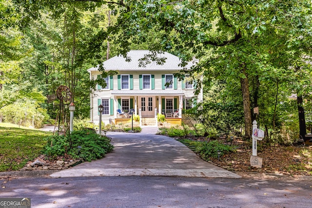 colonial home with a porch