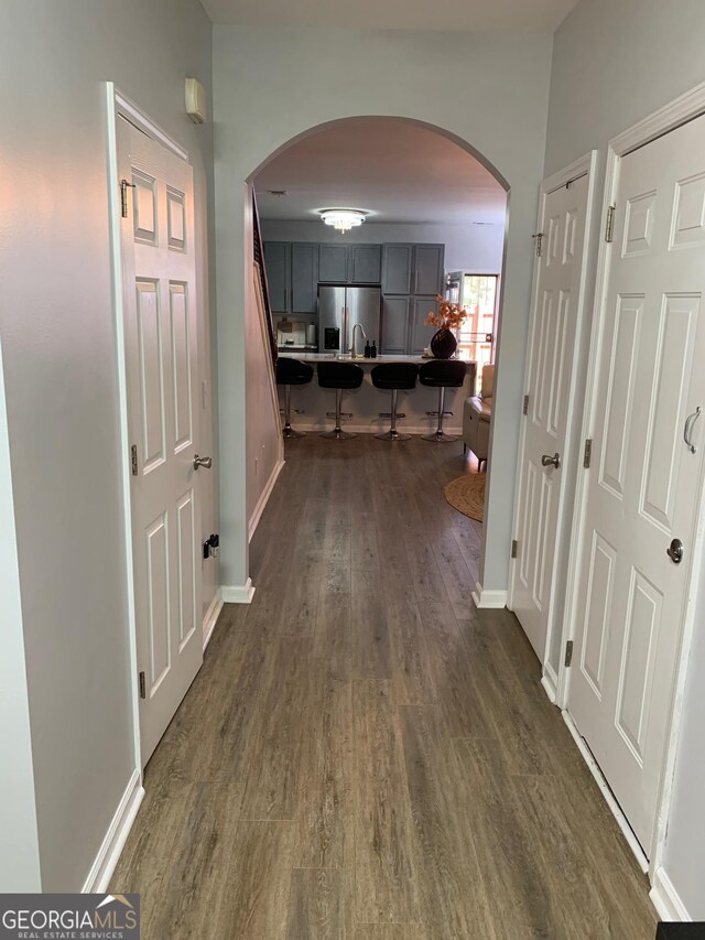 hall with dark hardwood / wood-style flooring