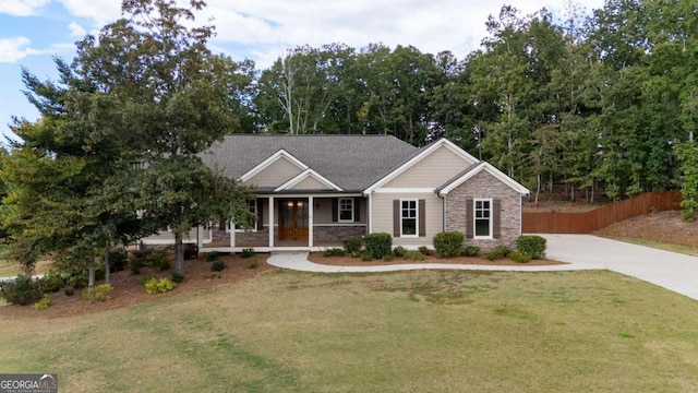 view of front of house featuring a porch and a front lawn