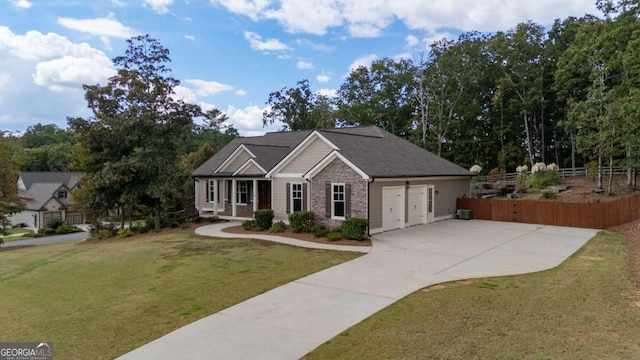 view of front of house featuring a garage and a front yard