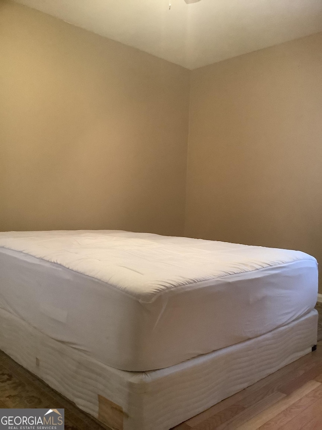 unfurnished bedroom with wood finished floors