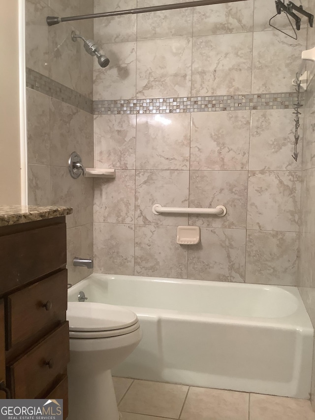 bathroom featuring tile patterned flooring, vanity, toilet, and shower / bathing tub combination