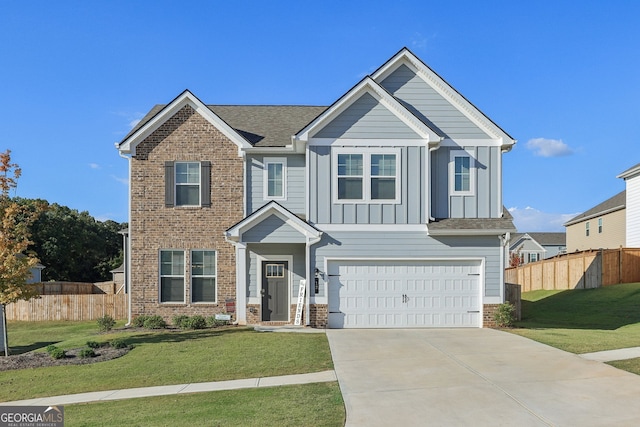 view of front of house featuring a garage and a front lawn